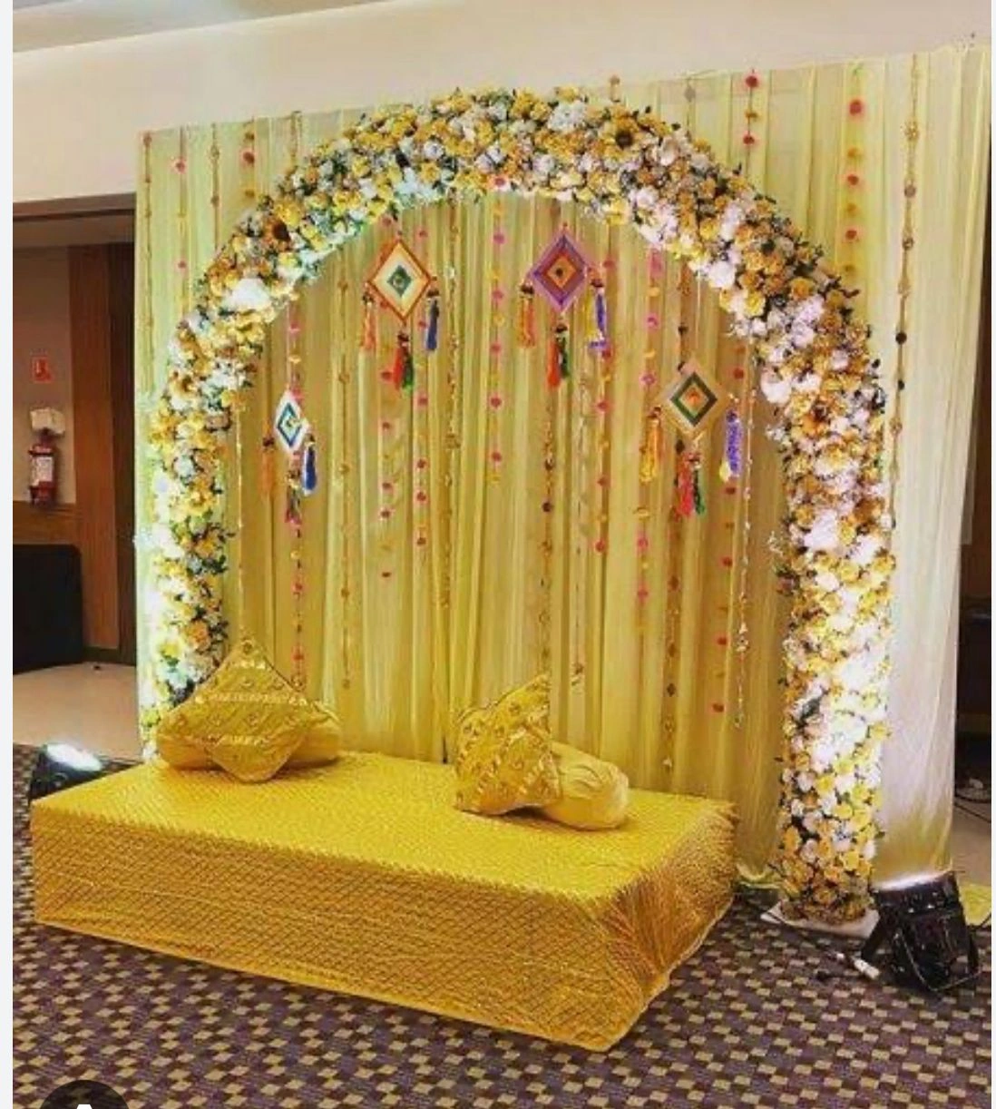 Traditional Haldi ceremony with marigold flowers and turmeric paste