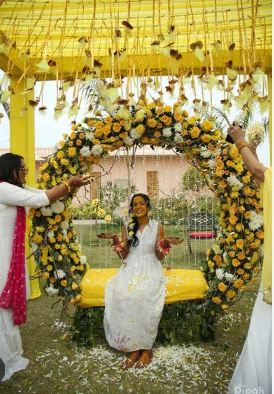 Floral Haldi ceremony with colorful flowers and petals